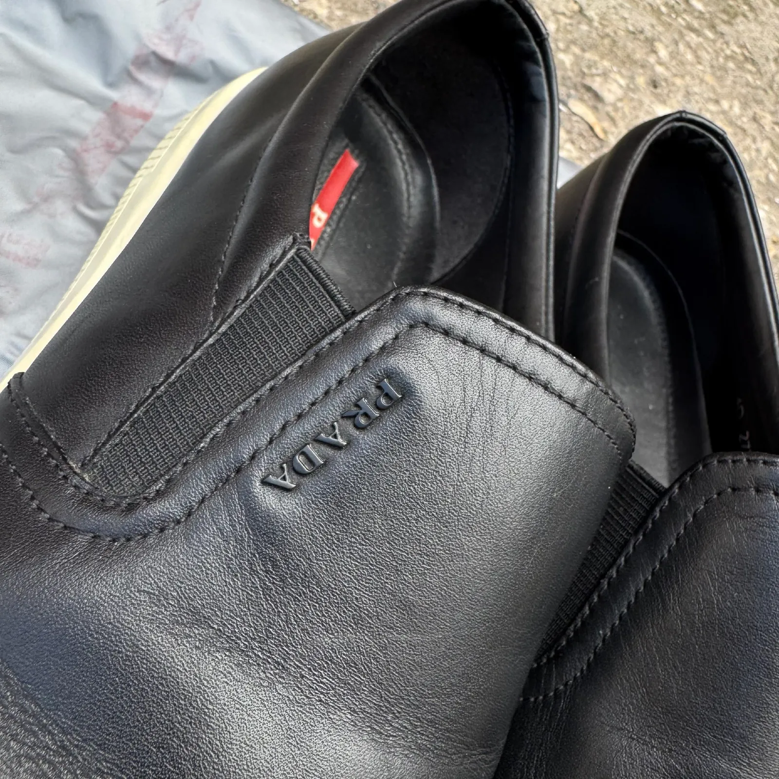 Prada Black Leather Slip-On Sneakers