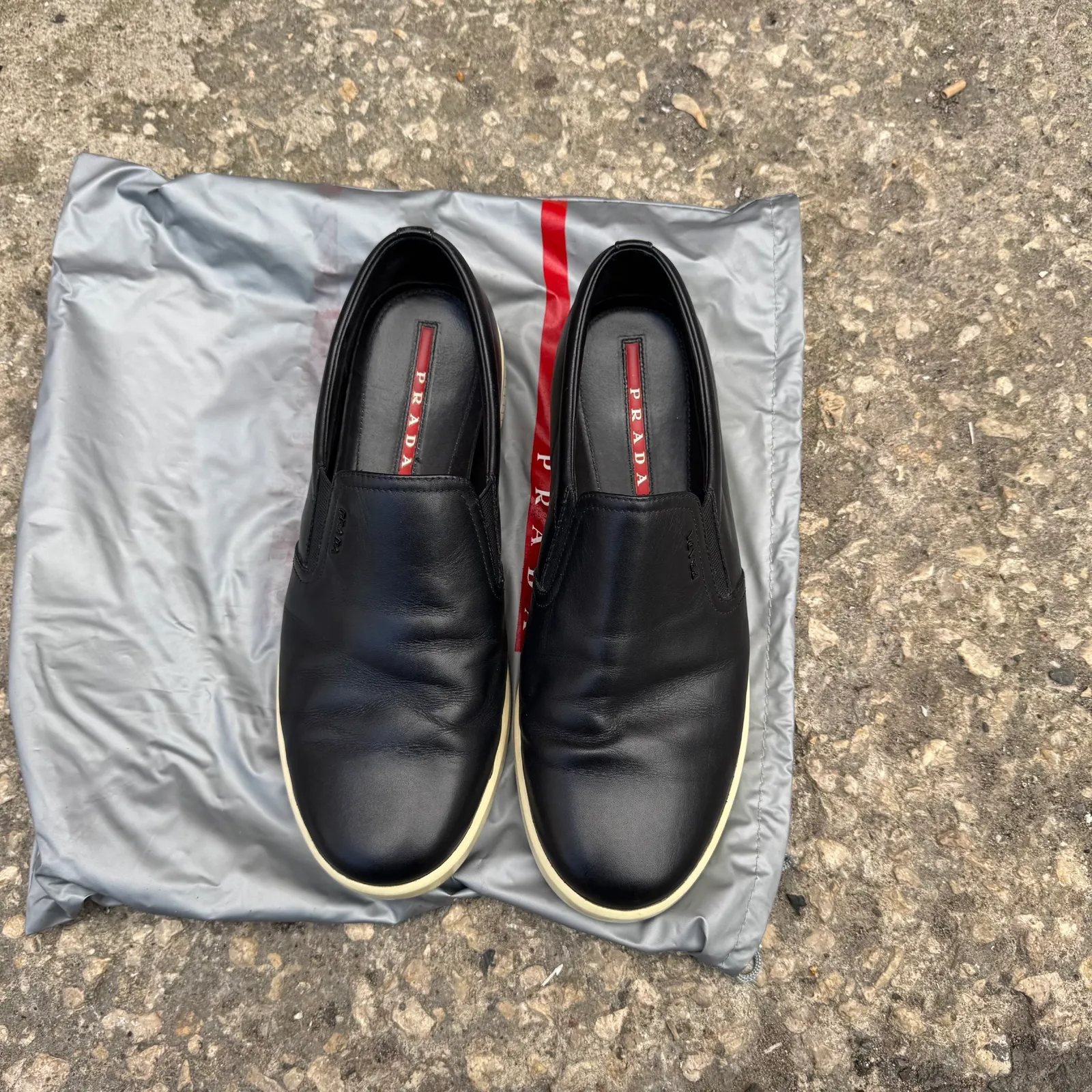 Prada Black Leather Slip-On Sneakers
