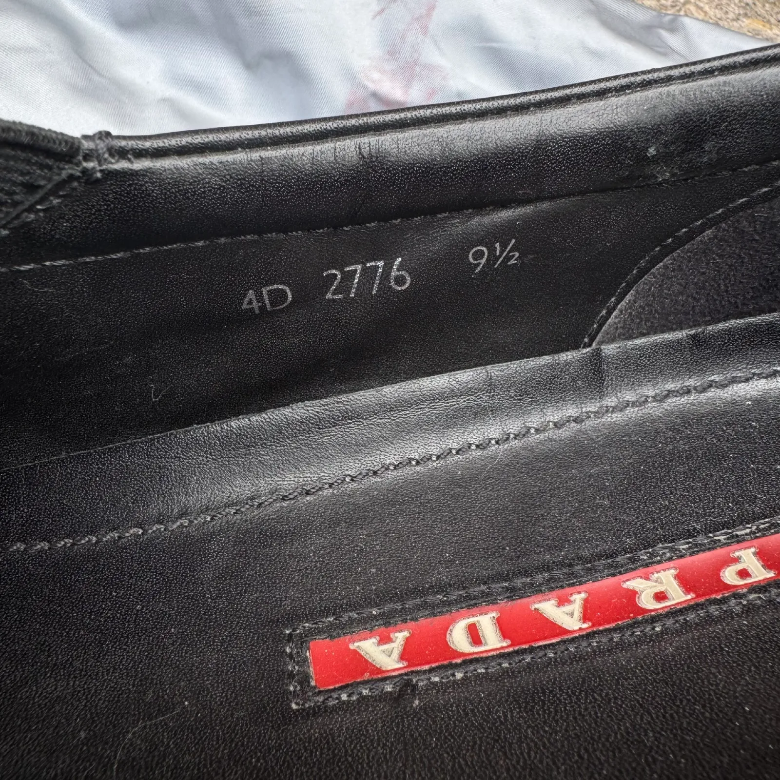 Prada Black Leather Slip-On Sneakers