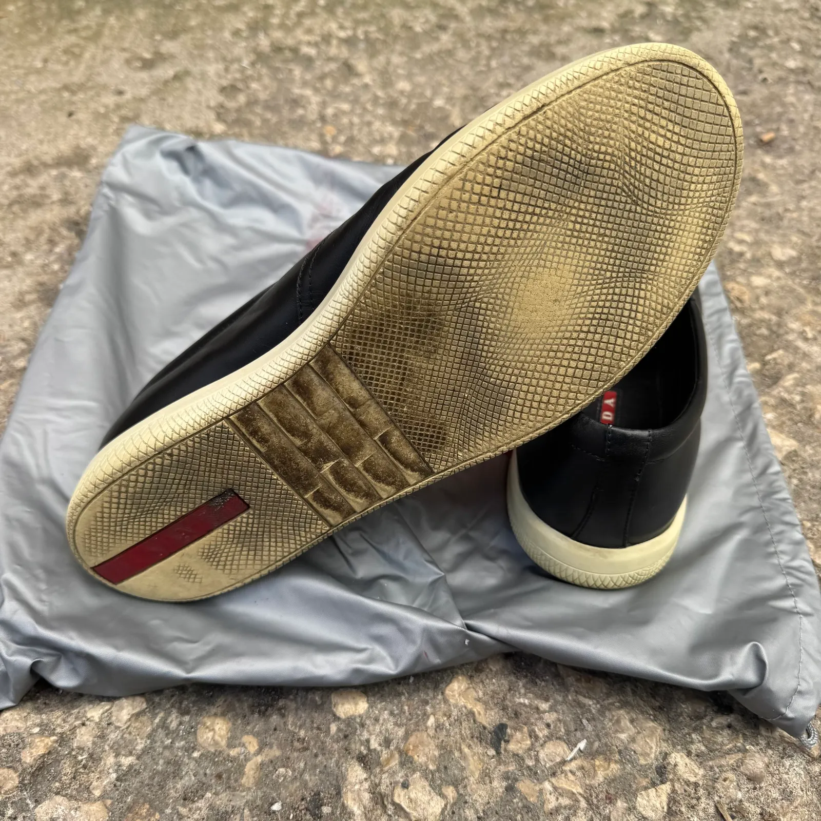 Prada Black Leather Slip-On Sneakers