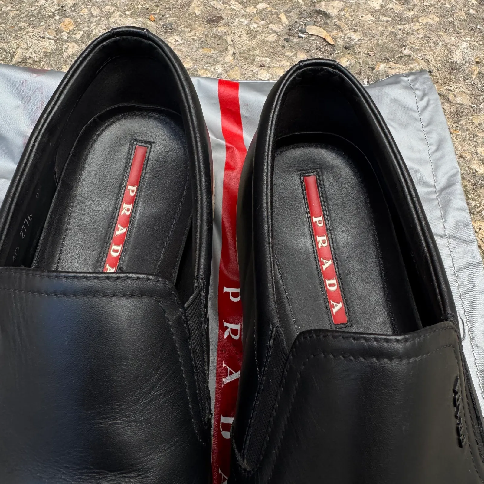 Prada Black Leather Slip-On Sneakers